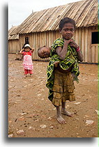 Little Girl Carrying Younger Brother::Antoetra, Madagascar::