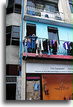 An Old Lady on the Balcony::Male, capital city of Maldives::