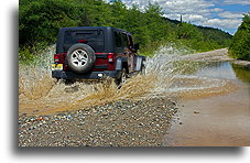 Road by Lloyds River::A small water crossing::